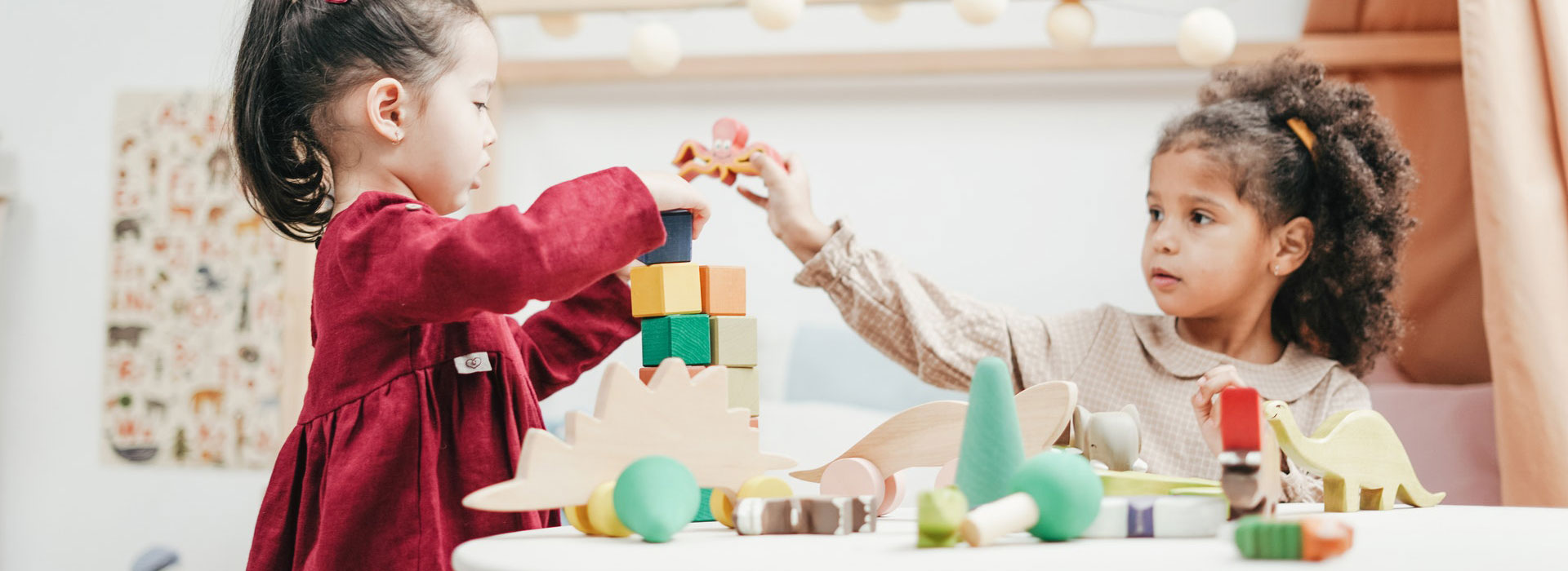 image of a children playing together at child care with blocks